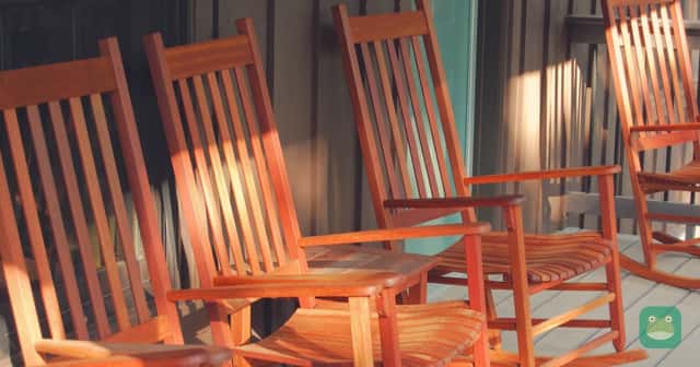 Wooden rocking chairs on a cabin porch at Shenandoah River State Park in Virginia.