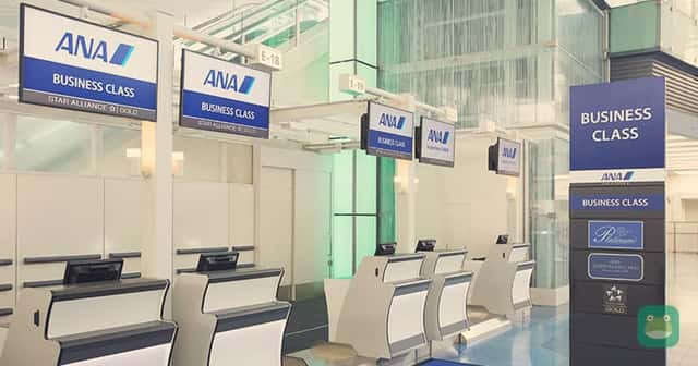 ANA business-class check-in desks, shown as a representative airline facility. Award availability and cabin eligibility are separate checks.