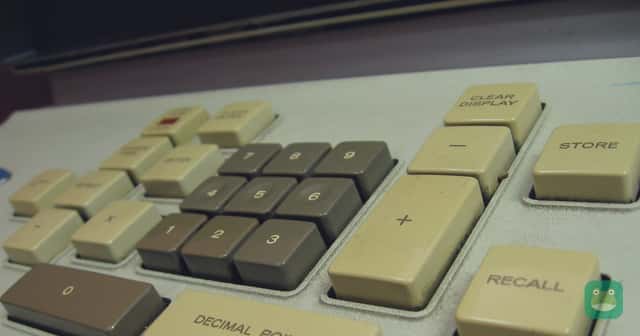 The keypad of an old desktop calculator, with its decimal point, store and recall keys.