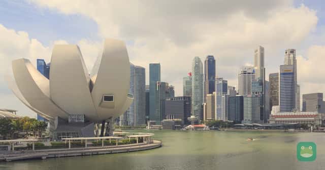Marina Bay in Singapore, with the ArtScience Museum and the city's skyline, seen from the Helix Bridge.