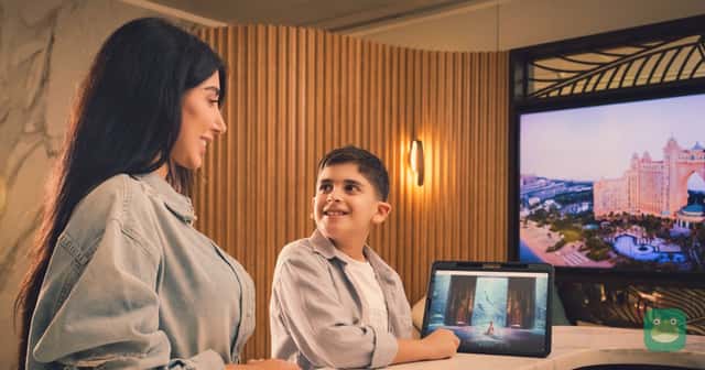 Visitors check in at a Dubai hotel. Emirates Skywards members can earn one bonus mile per minute spent in Dubai.